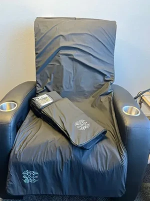 A comfy reclining chair at Health & Wellness Chiropractic Center covered with a KLOUD Mat