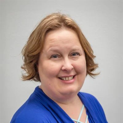 A headshot photo of Melissa, the office manager at Health & Wellness Chiropractic Center